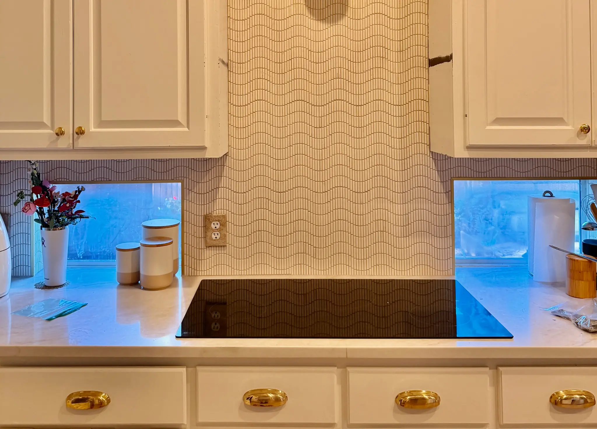 Kitchen backsplash installation with wavy pattern in Austin