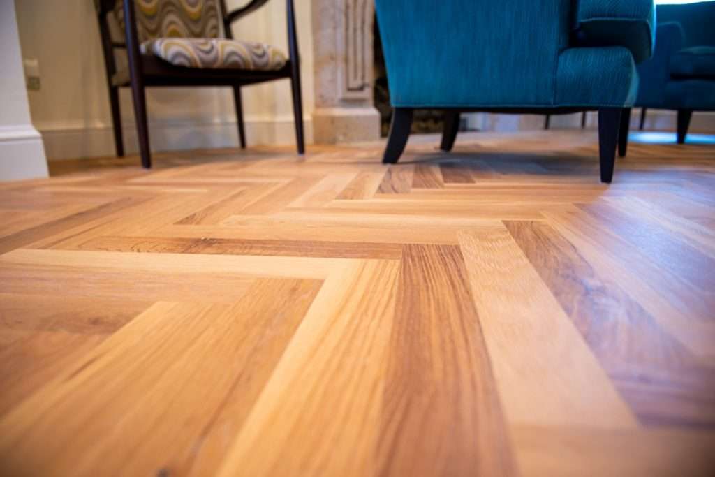 Wide plank natural hardwood flooring in Austin living room