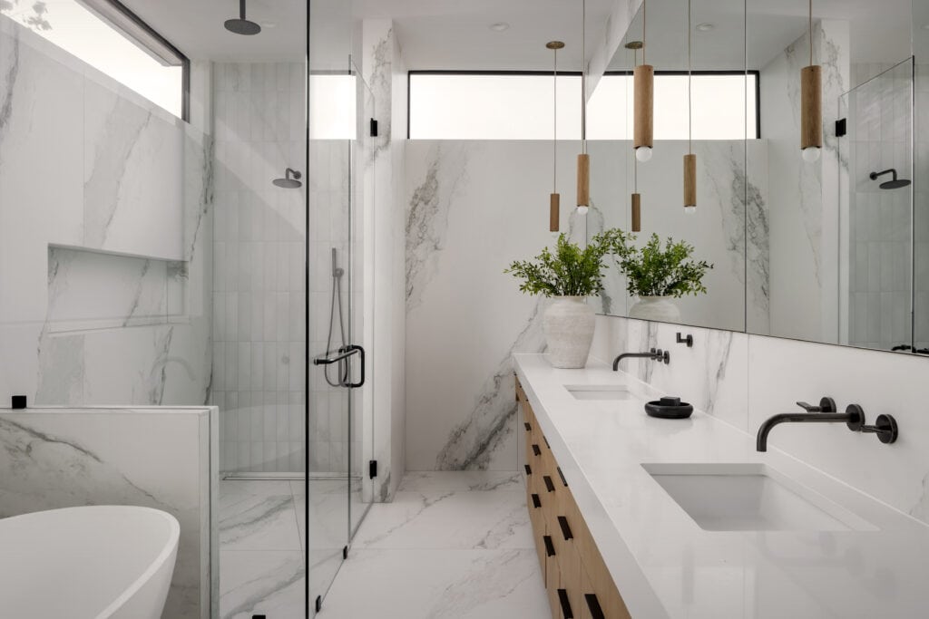 Modern bathroom with white subway tile shower in Austin